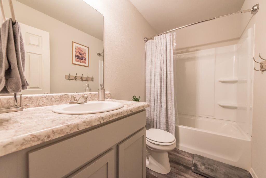 Spotless bathroom with modern fixtures, ample counter space, and a relaxing atmosphere. Perfect for your next stay | Dream TDY