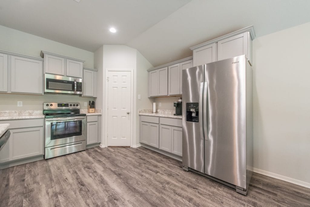 Modern kitchen with stainless steel appliances, ample cabinetry, and clean finishes. Ideal for meal prep and short-term stays | Dream TDY
