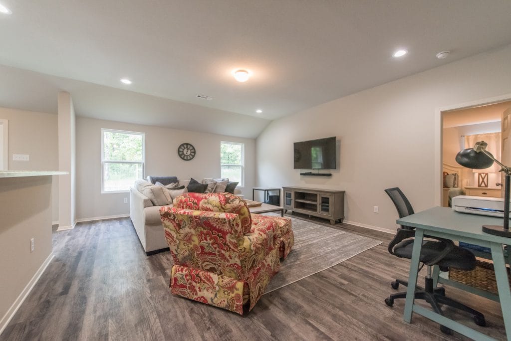 Bright, open living area with cozy furniture, dedicated workspace, modern TV, and stylish decor—perfect for relaxation | Dream TDY