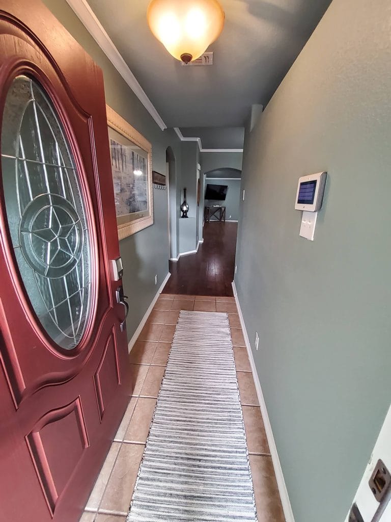 Inviting entryway with stylish decor, natural light, and a clean, modern finish. Move-in ready for your convenience | Dream TDY