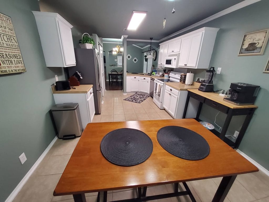 Stylish kitchen with modern appliances, clean counters, and a cozy dining area. Perfect for meal prep and relaxation | Dream TDY