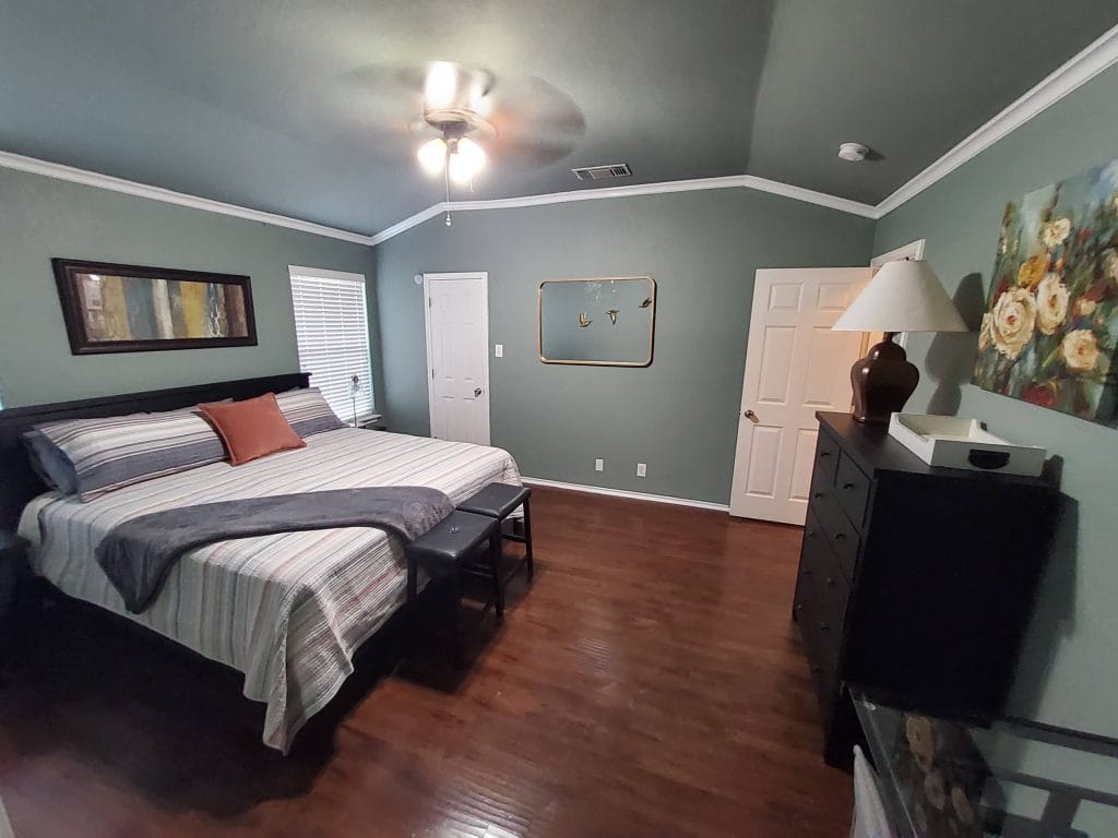 Spacious bedroom featuring a cozy king-sized bed, modern decor, ample storage, and natural light | Dream TDY