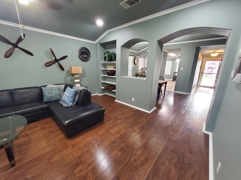 Stylish living area with sleek furniture, polished wood floors, and ample natural light. Perfect for relaxing or working | Dream TDY