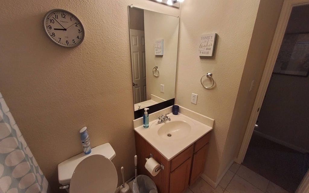Modern bathroom with pristine fixtures, ample counter space, and convenient amenities for a comfortable stay | Dream TDY