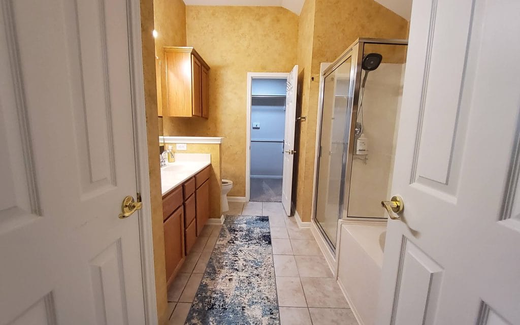 Spacious bathroom with modern fixtures, tasteful decor, and a relaxing atmosphere. Includes a shower and ample storage | Dream TDY