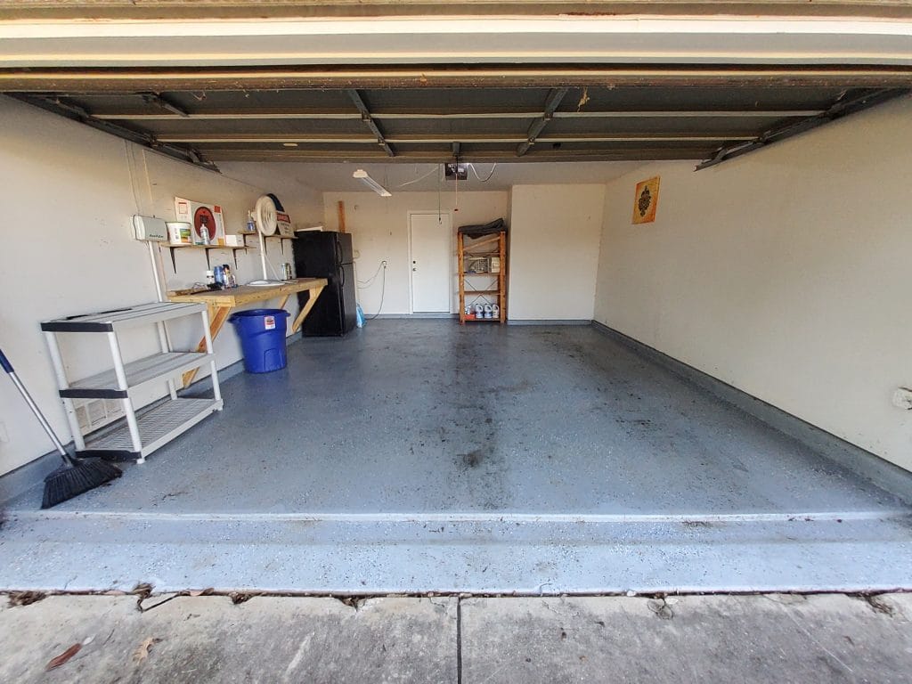 Spacious, clean garage with organized shelving, modern appliances, and a dedicated workspace for your convenience | Dream TDY