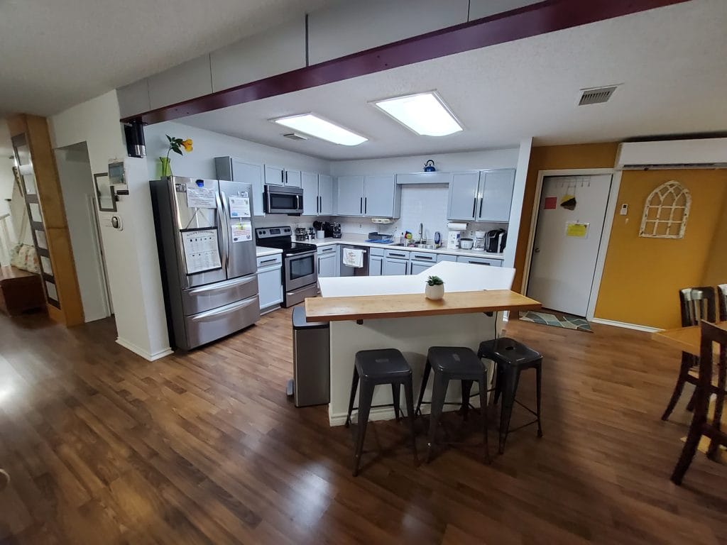 Bright, open kitchen with modern appliances, a cozy dining area, and ample counter space | Dream TDY