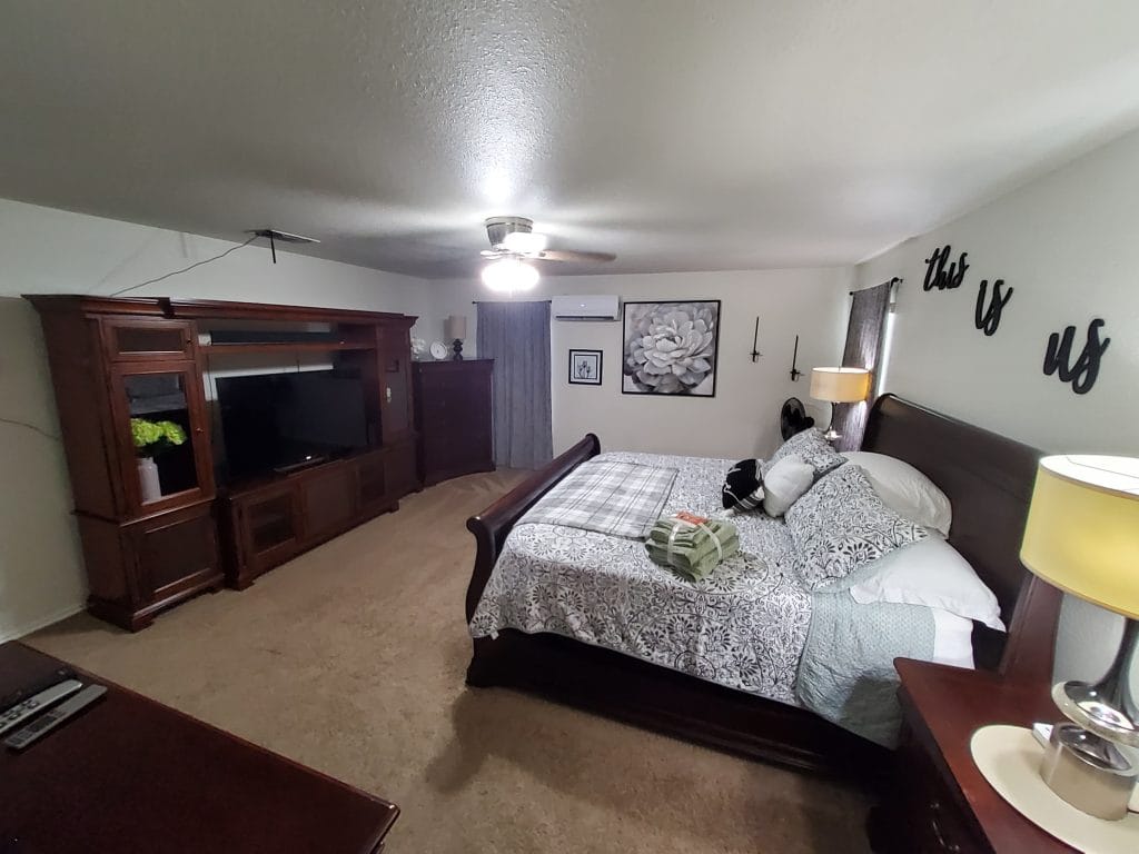 Spacious bedroom featuring elegant furnishings, modern TV, and cozy decor. Ideal for relaxation and a peaceful stay | Dream TDY