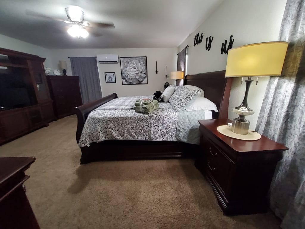 Spacious bedroom with cozy furnishings, modern lighting, and a clean aesthetic. Perfect for relaxation and focus | Dream TDY