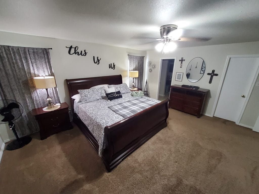 Cozy bedroom featuring a plush king bed, modern decor, ample storage, and great natural light | Dream TDY