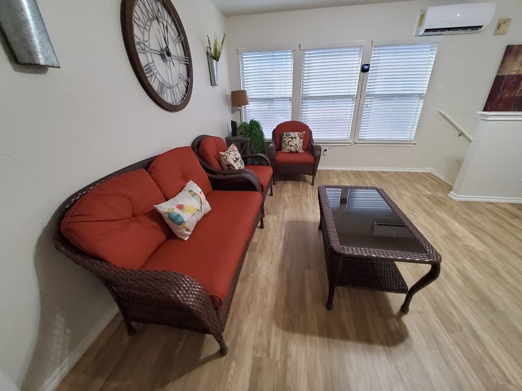 Bright and inviting living space with modern furnishings, ample seating, and large windows for natural light | Dream TDY