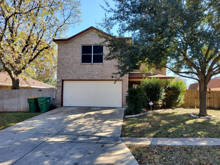 Charming two-story home with a clean façade, spacious driveway, and inviting outdoor space for relaxation | Dream TDY