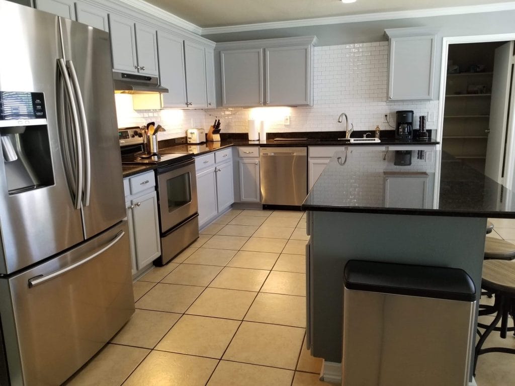 Modern kitchen featuring stainless steel appliances, spacious countertops, and ample storage for a seamless cooking experience | Dream TDY