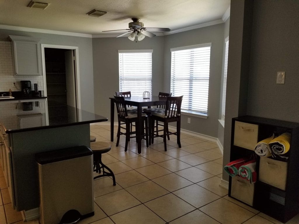 Bright, airy dining area with modern furnishings, sleek appliances, and ample workspace. Perfect blend of comfort and style | Dream TDY