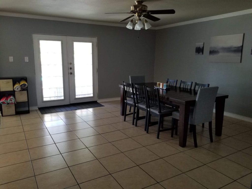 Spacious dining area with modern furnishings, natural light, and a cozy ambiance, perfect for gatherings | Dream TDY