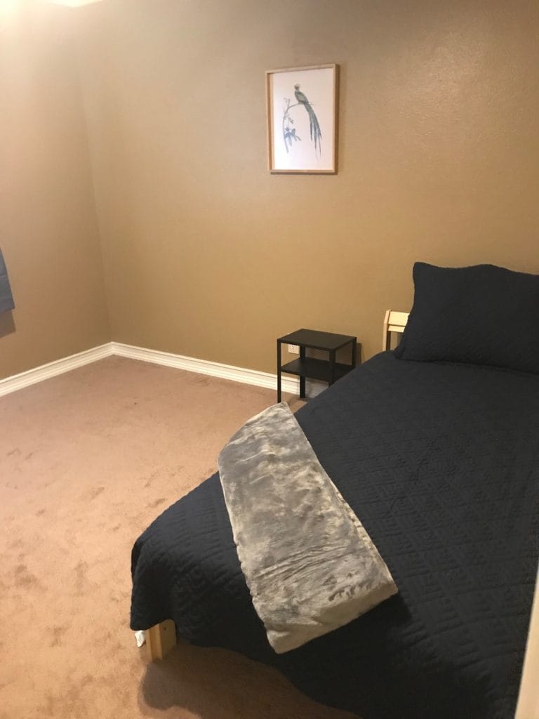 Cozy bedroom with a comfortable bed, soft linens, and clean, warm decor. Perfect for restful stays | Dream TDY