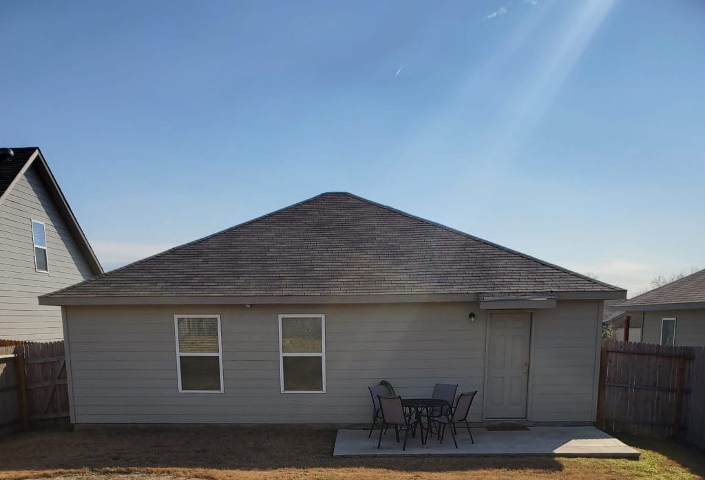 Charming outdoor space with seating, perfect for relaxation. Close proximity to key amenities for a comfortable stay | Dream TDY