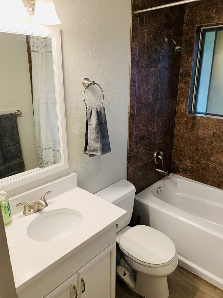 Modern bathroom featuring a clean design, sleek fixtures, and a relaxing tub for a rejuvenating experience | Dream TDY