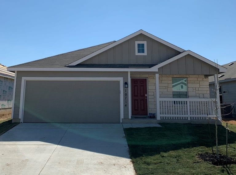 Charming single-family home with a cozy porch, well-maintained exterior, and a spacious driveway | Dream TDY