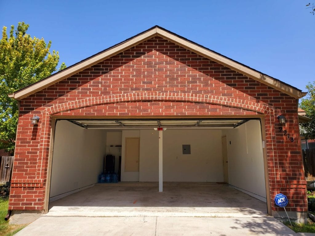 Spacious, clean garage with ample storage space, ideal for vehicle parking or equipment storage | Dream TDY