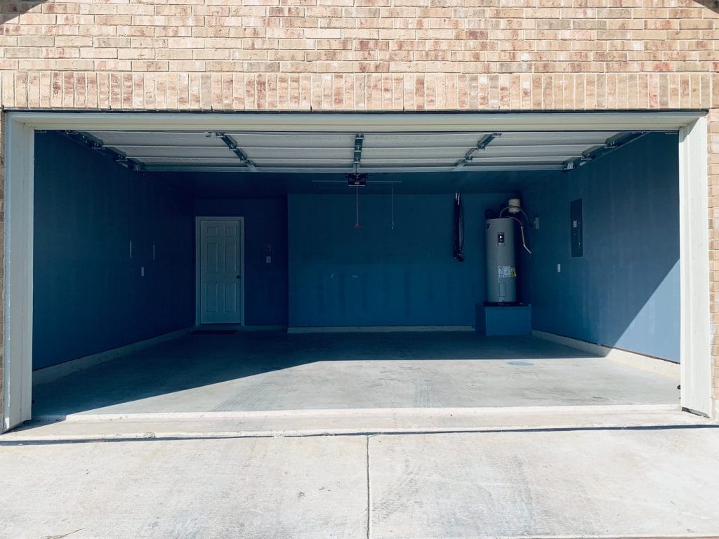 Spacious garage offering ample storage and workspace, clean finish, and convenient access to utilities | Dream TDY