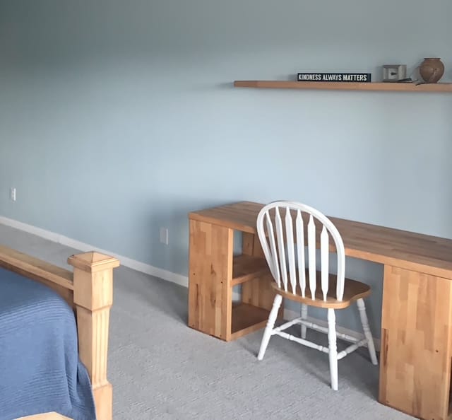 Bright and spacious bedroom featuring modern furniture, a cozy desk area, and a calming color palette | Dream TDY