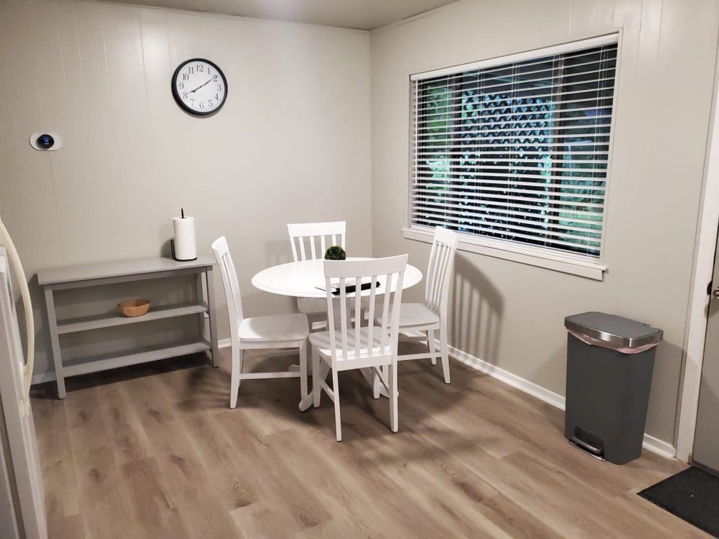 Bright dining area with a cozy table, modern appliances, and clean finishes. Ideal for short-term stays | Dream TDY