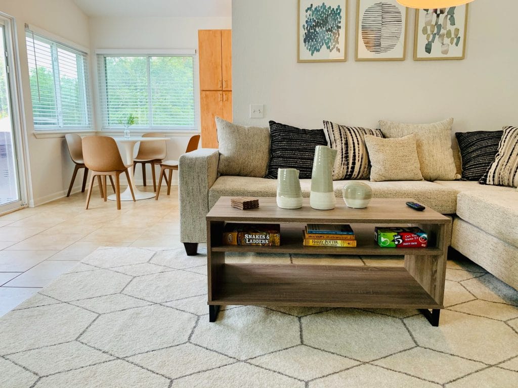 Bright living area with cozy sofa, modern decor, cozy dining nook, and a clean aesthetic| Dream TDY