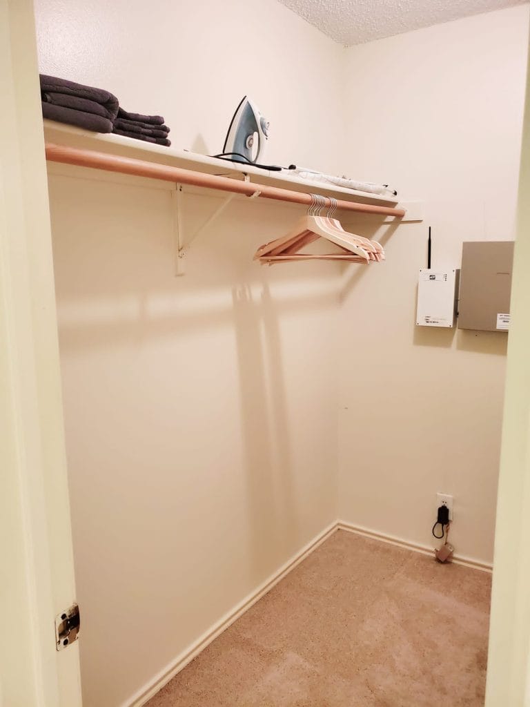 Spacious closet equipped with ironing essentials and ample storage for a comfortable stay | Dream TDY