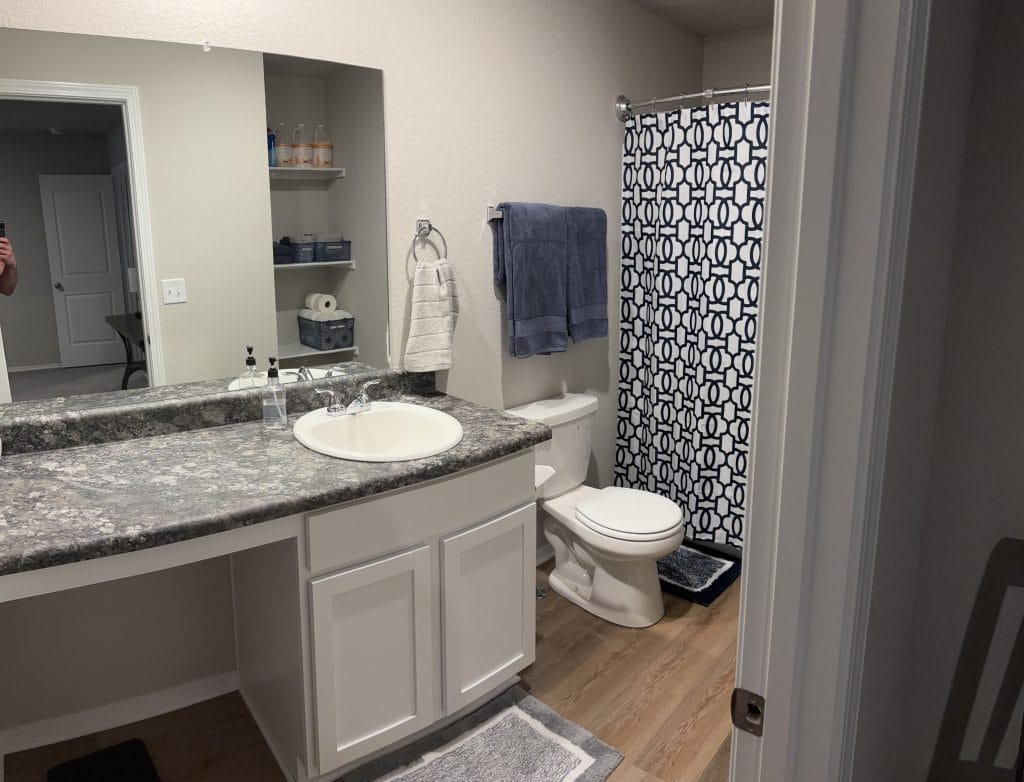 Stylish bathroom with modern fixtures, ample counter space, and chic décor. Clean and inviting, ideal for short stays | Dream TDY