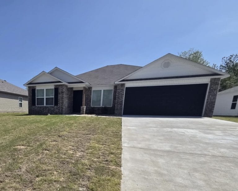 Charming exterior with modern curb appeal, large garage, and ample outdoor space for relaxation | Dream TDY