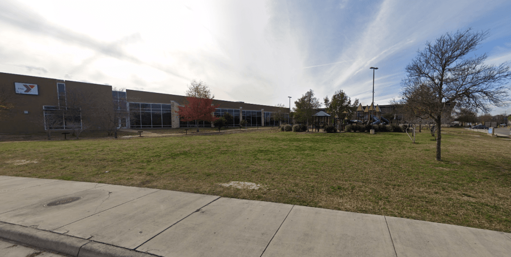 Spacious outdoor area with well-maintained landscaping, ideal for relaxation. Close to amenities for a comfortable stay | Dream TDY