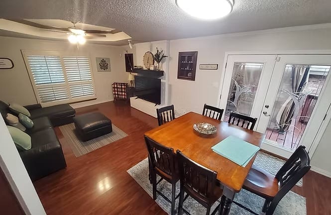 Bright, inviting living space featuring modern furnishings, dedicated dining area, and access to outdoor enjoyment | Dream TDY