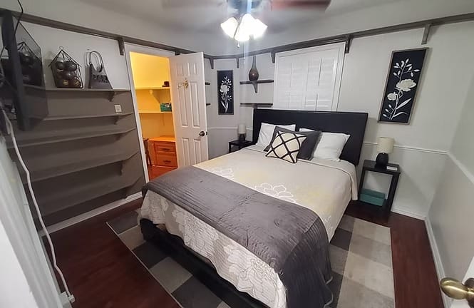 Cozy bedroom features a comfortable queen bed, stylish decor, ample storage, and enhances relaxation for your stay | Dream TDY