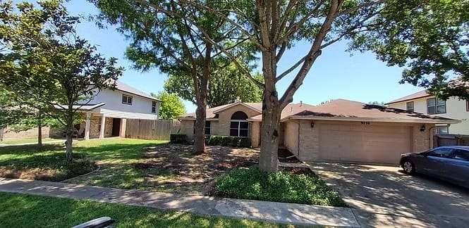 Spacious yard with lush greenery, ideal for relaxation. Modern exterior with ample parking. Close to amenities | Dream TDY