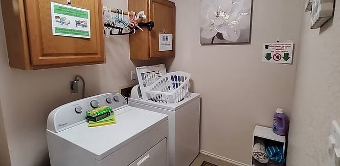 Bright laundry room with modern appliances, ample storage, and a tidy layout for convenience | Dream TDY