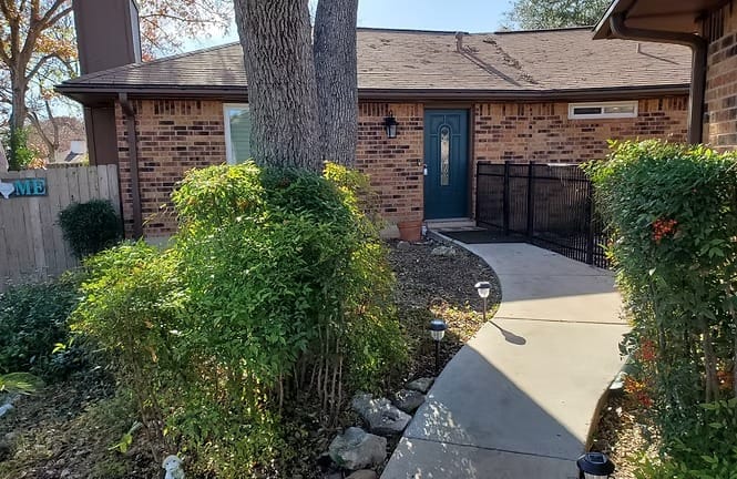 Welcoming entrance with lush greenery, neat pathway, and modern charm. Ideal for a relaxing stay | Dream TDY