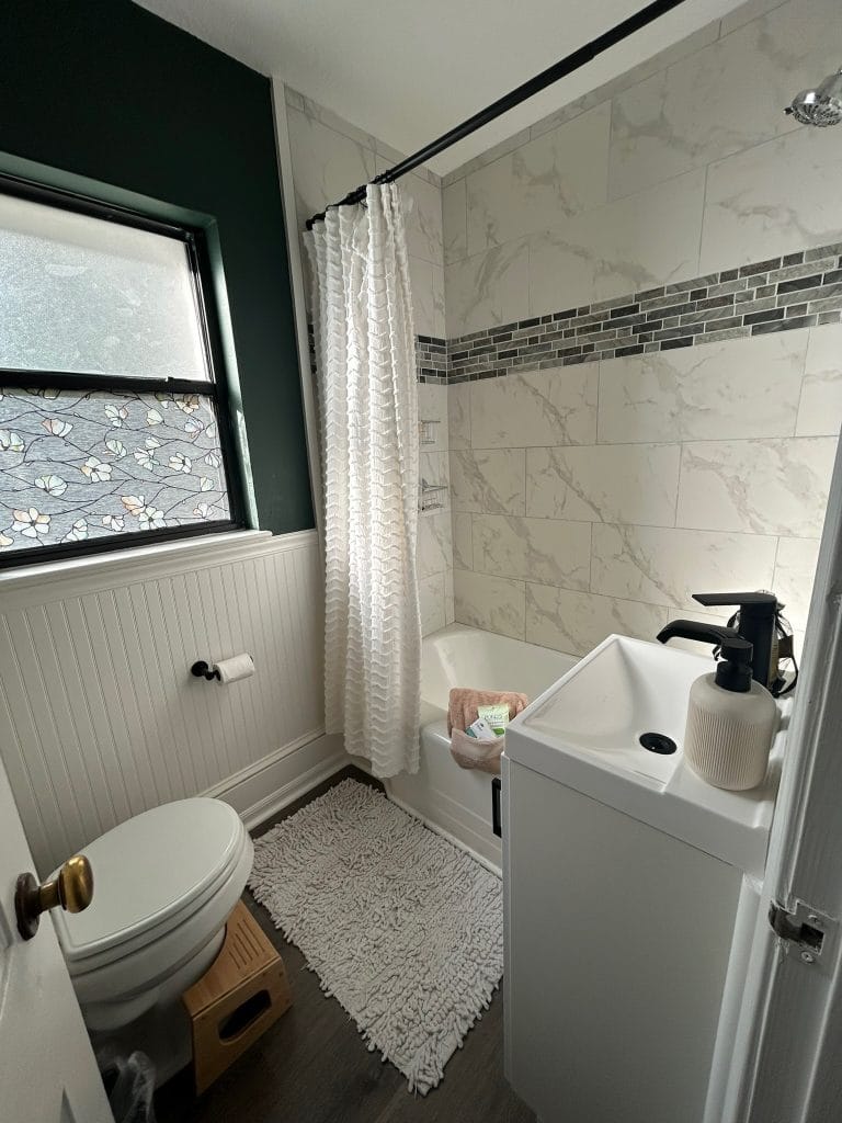 Freshly renovated bathroom featuring a relaxing tub, modern fixtures, and soft textiles for a cozy feel | Dream TDY