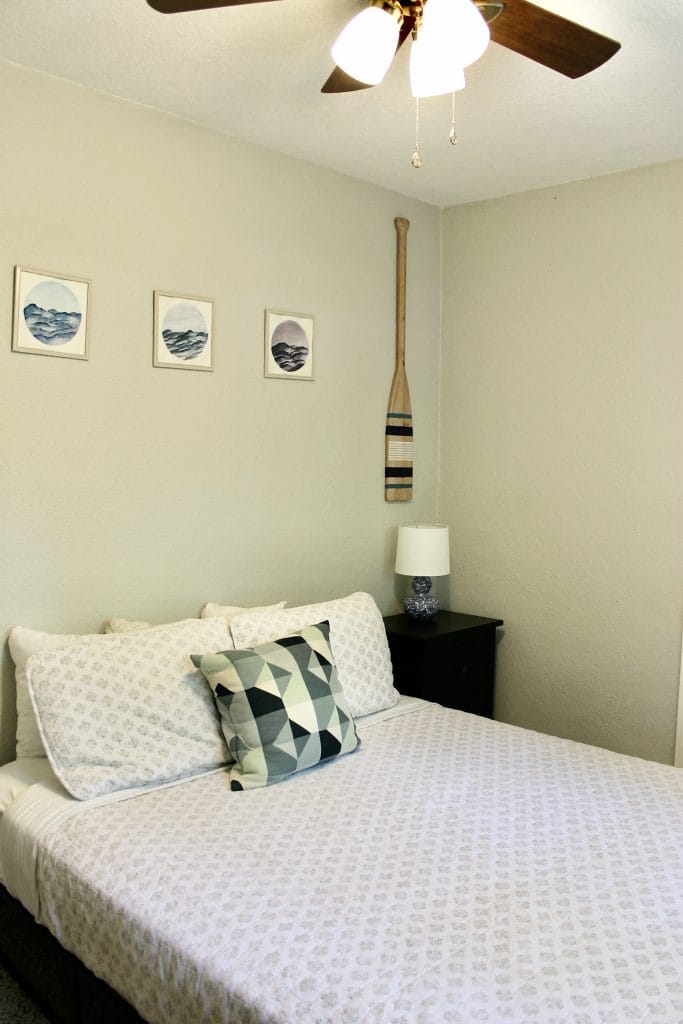 Cozy bedroom with stylish decor, clean linens, and a dedicated nightstand. Perfect for a restful stay | Dream TDY