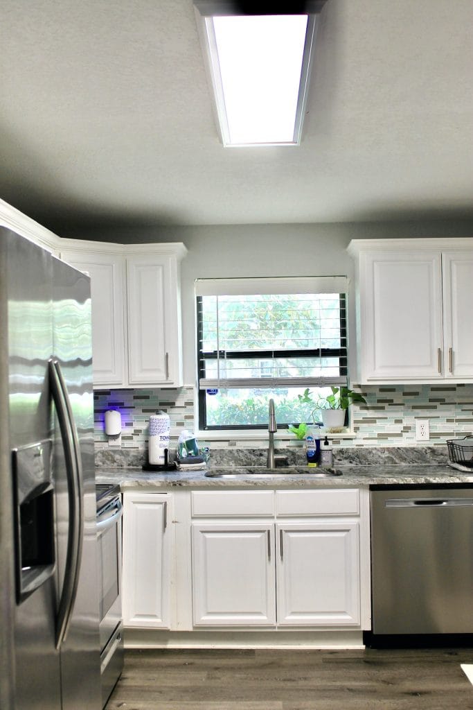 Stylish kitchen featuring modern stainless steel appliances, granite countertops, and ample natural light. Perfect for meal prep | Dream TDY