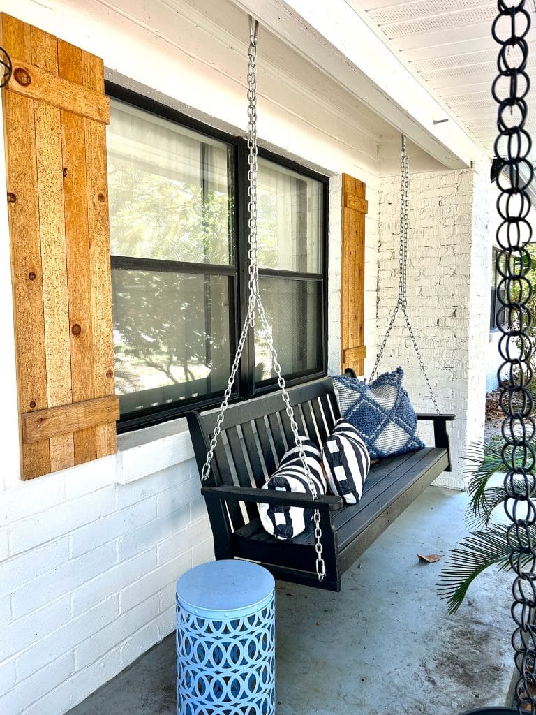 Charming outdoor swing with cozy pillows and unique decor, perfect for relaxation after a long day | Dream TDY