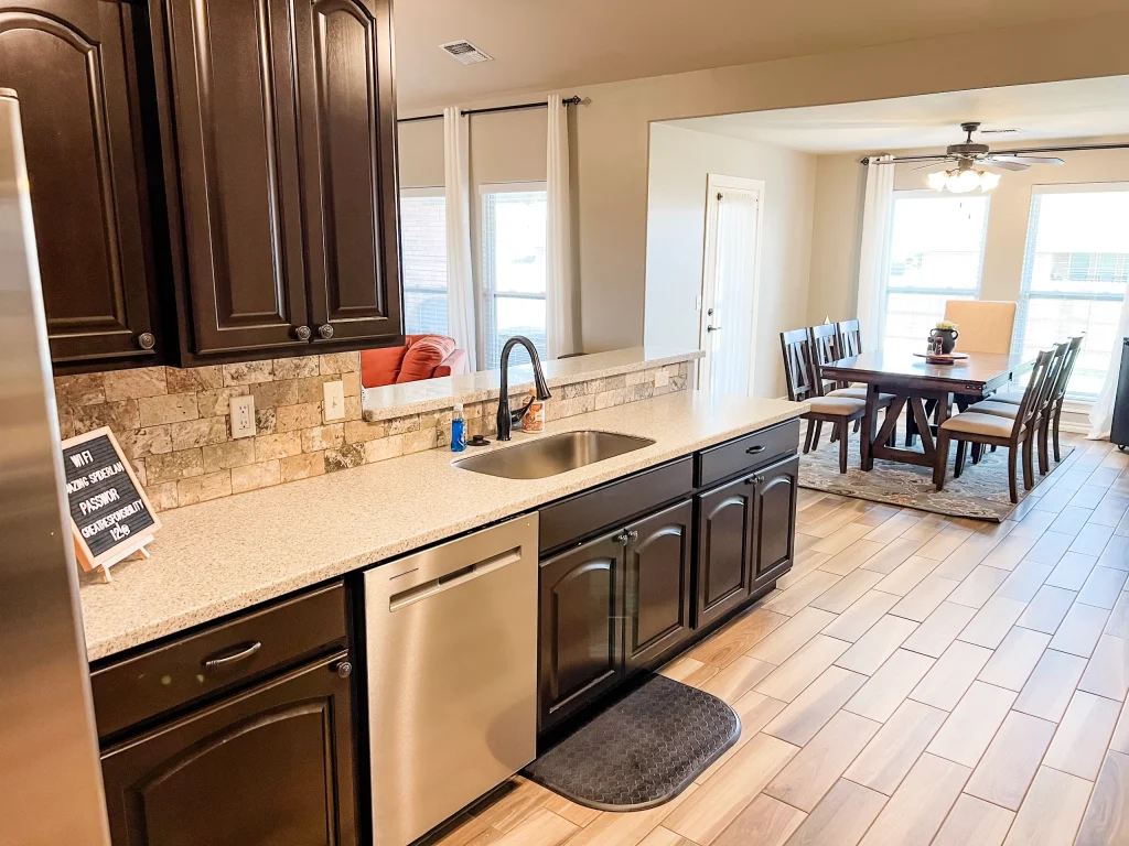 Modern kitchen with sleek appliances, ample counter space, and a cozy dining area; perfect for family meals | Dream TDY