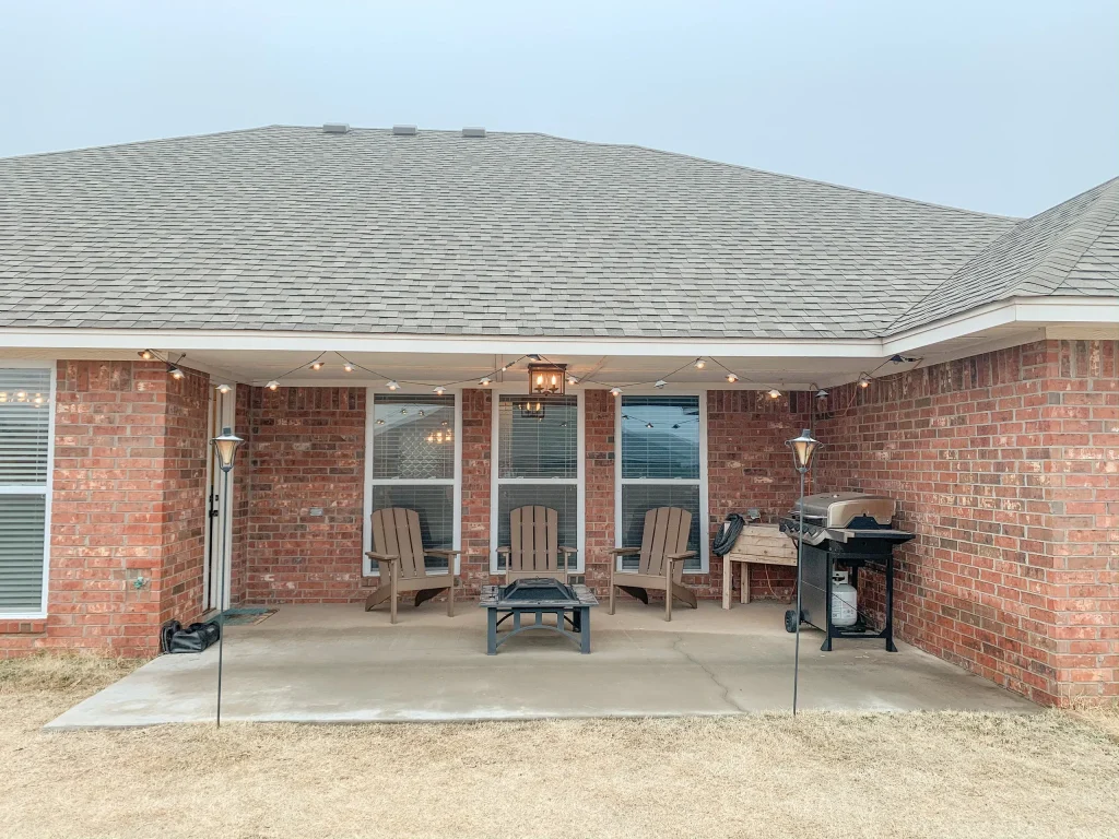 Spacious outdoor patio featuring cozy seating and a grill, perfect for relaxation and entertaining | Dream TDY