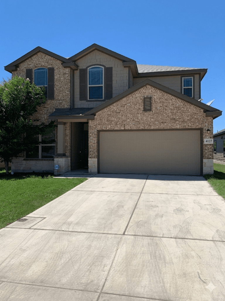 Charming modern exterior with ample driveway space, perfect for military families seeking comfort and convenience | Dream TDY