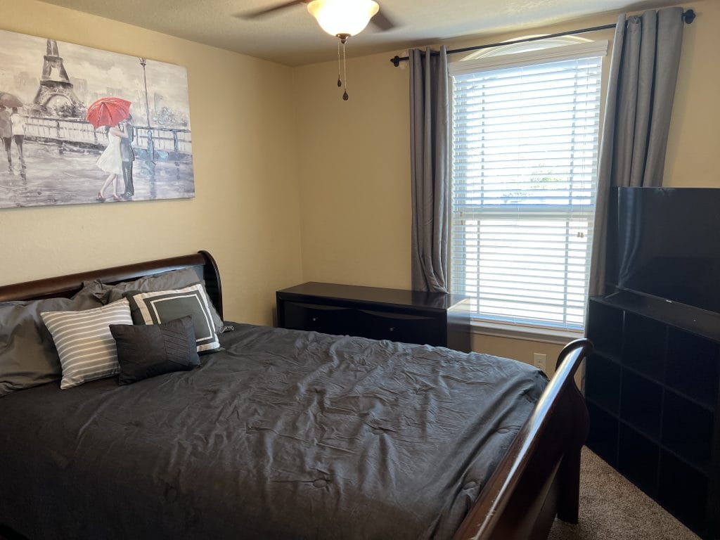 Cozy bedroom featuring a stylish bed, modern decor, and ample natural light. Perfect for relaxation after duty. | Dream TDY